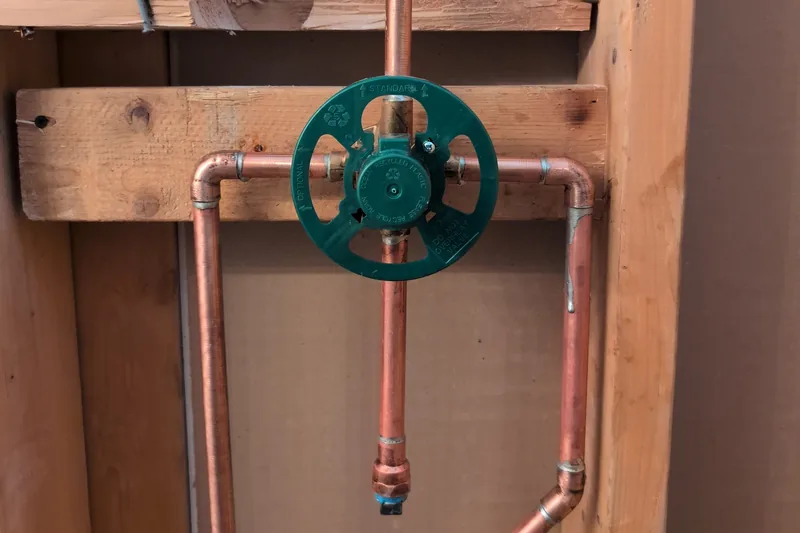 Clean copper supply lines and a water heater in a Northern Arizona utility space